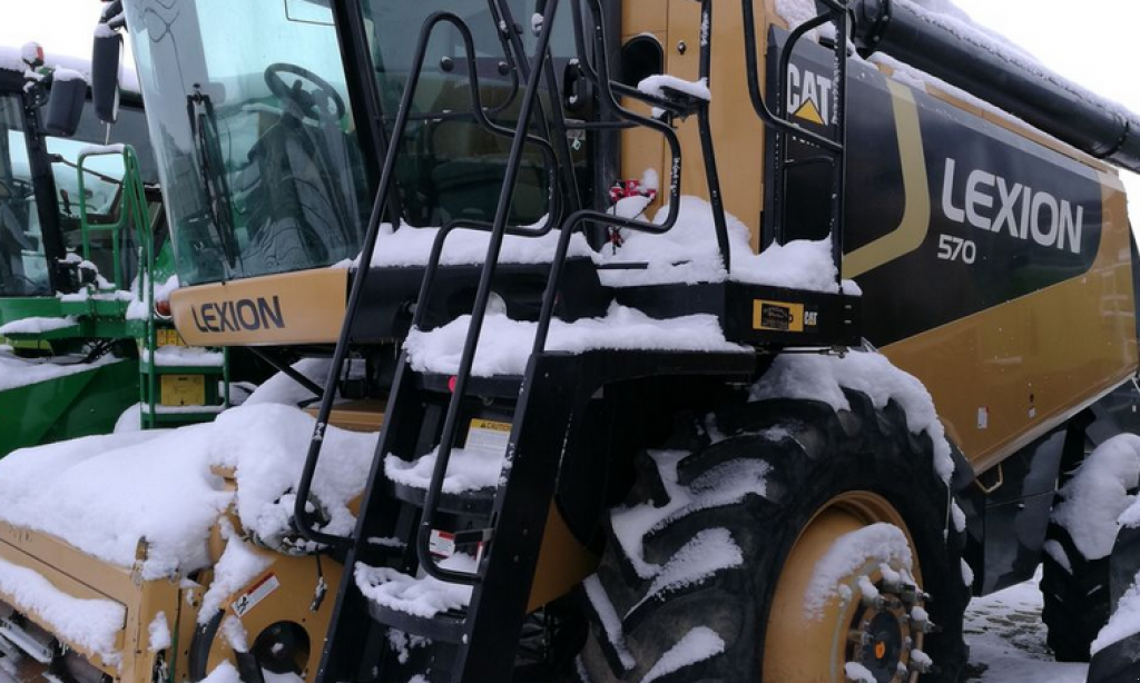 Oldtimer-Mähdrescher des Typs Caterpillar Lexion 570 W,  in Рівне (Bild 1)